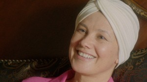 elena in bed with headscarf