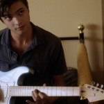 plays guitar for shah