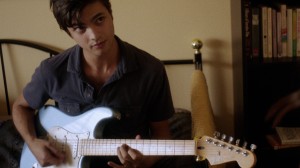 plays guitar for shah